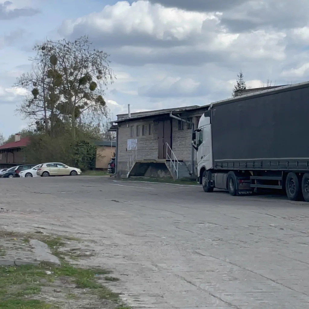 Truck waiting for loading at our warehouse. Loading parcels before a trip.